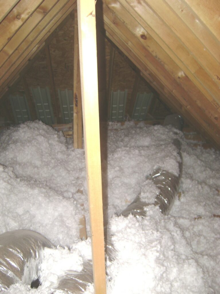 Blown-in Insulation Mounded in the Attic