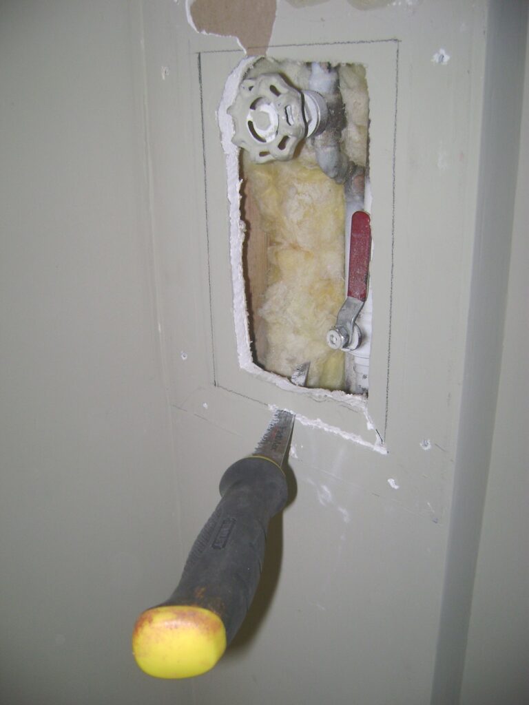 Sawing a Hole for the Drywall Access Panel