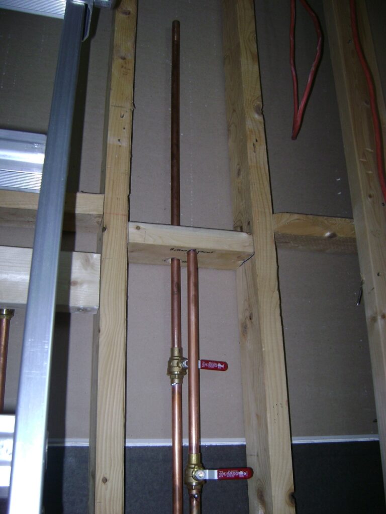 Basement Bathroom Plumbing Rough-in: Bracing Block for Copper Water Pipes