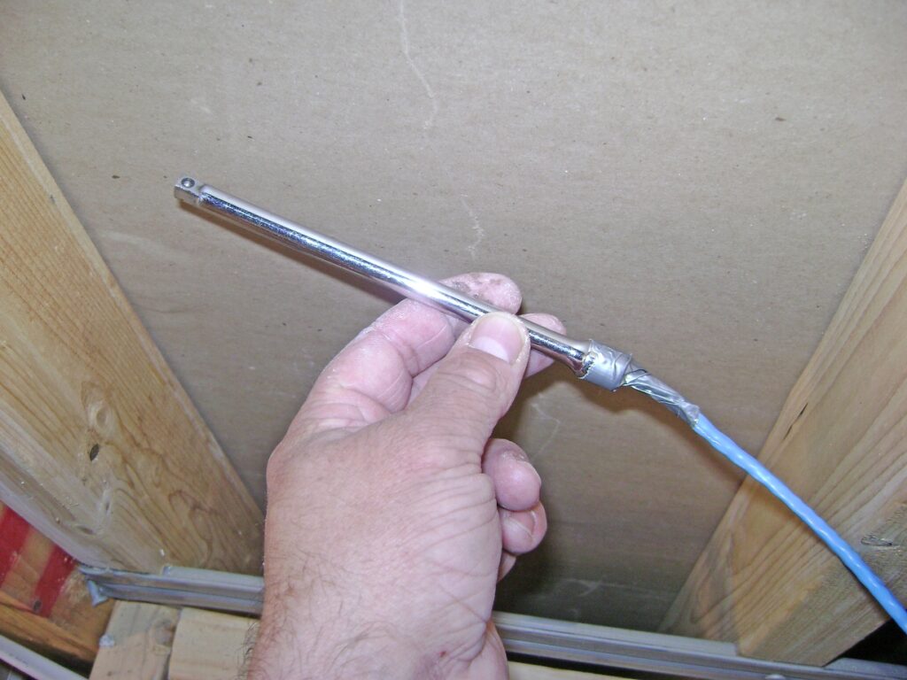 Fishing Ethernet Cable: Duct Tape Cable to a Socket Wrench Extension