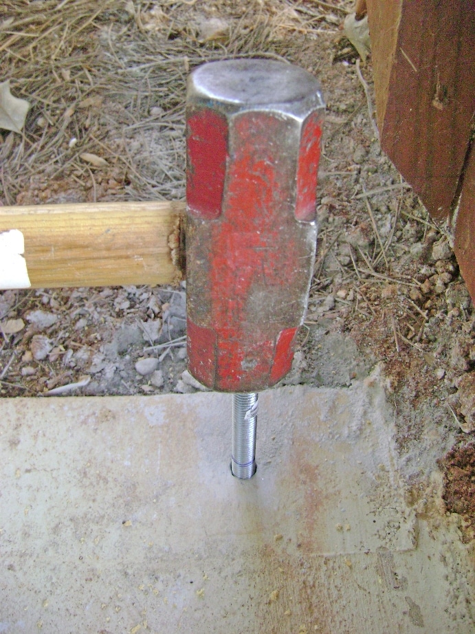 Build a Deck Rail on a Concrete Patio: Install the Concrete Anchor