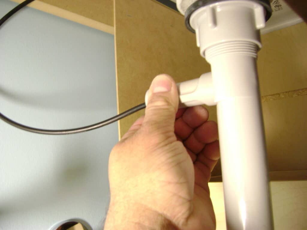 Bathroom Sink Drain: Connect the Popup Cable to the Drain Body