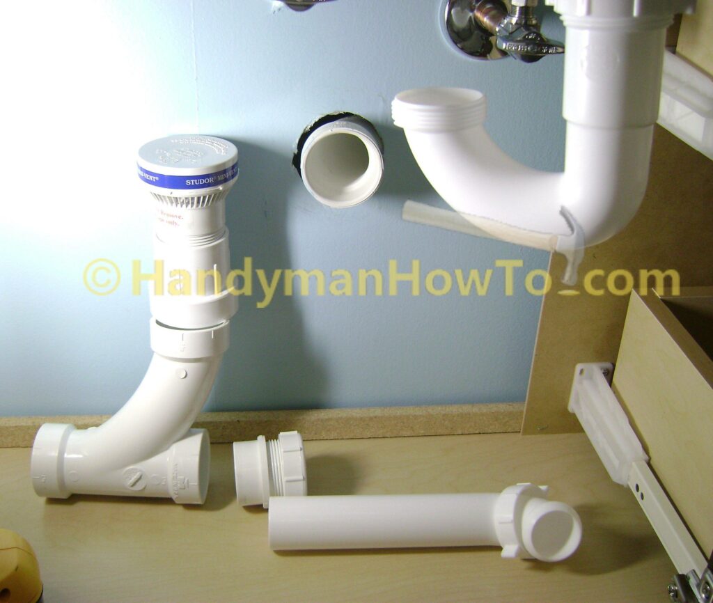 Install the Bathroom Sink Drain Plumbing: P-trap and PVC pipe fittings