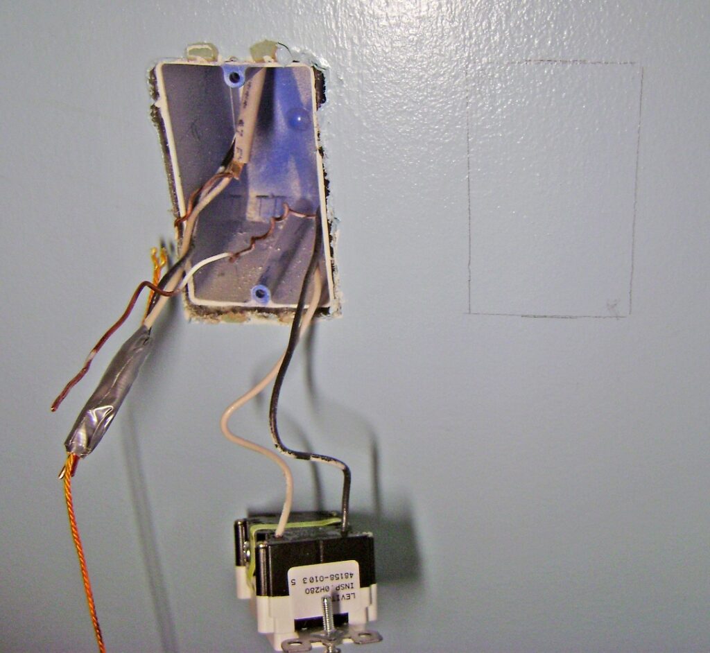 Install an Old Work Electrical Box: Box Outline Traced on the Drywall