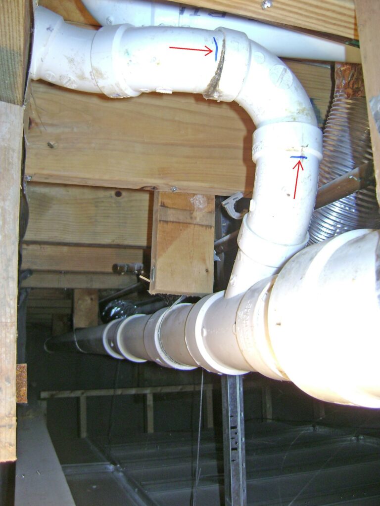 Leaky PVC Pipe Repair: Section Marked to be Cut Out