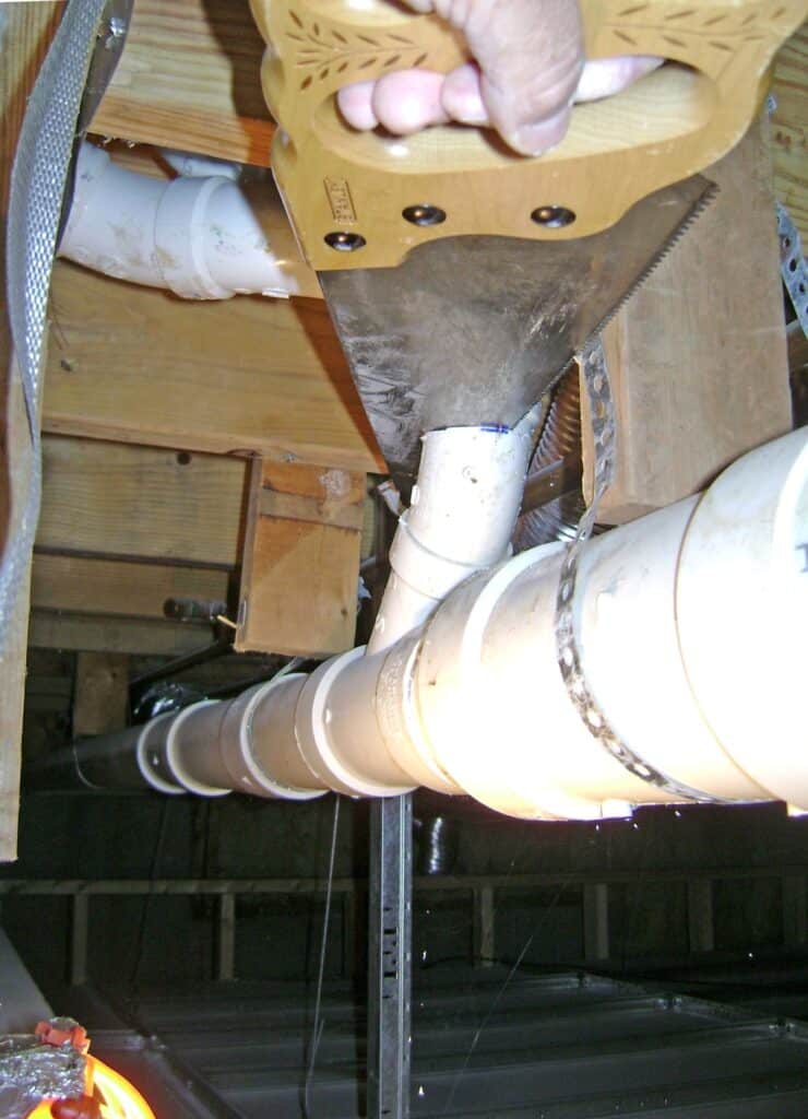 Leaky PVC Pipe Repair: Saw Off the Old Elbow Fitting