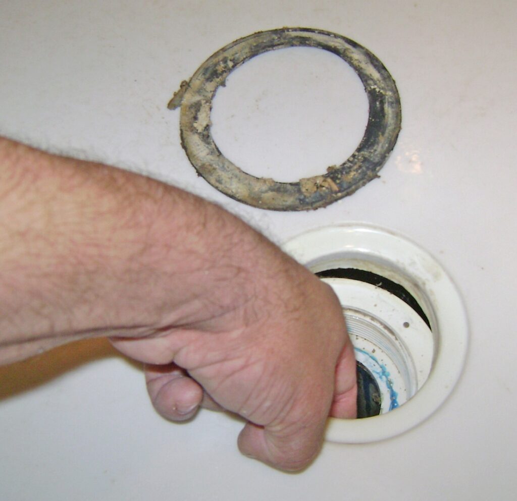 Leaky Shower Drain Repair: Remove the Rubber Gasket and Clean the Drain