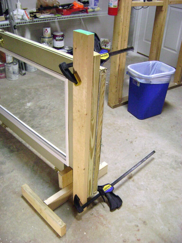 2x4s Clamped to Door for the Jigsaw Straight Edge Guide