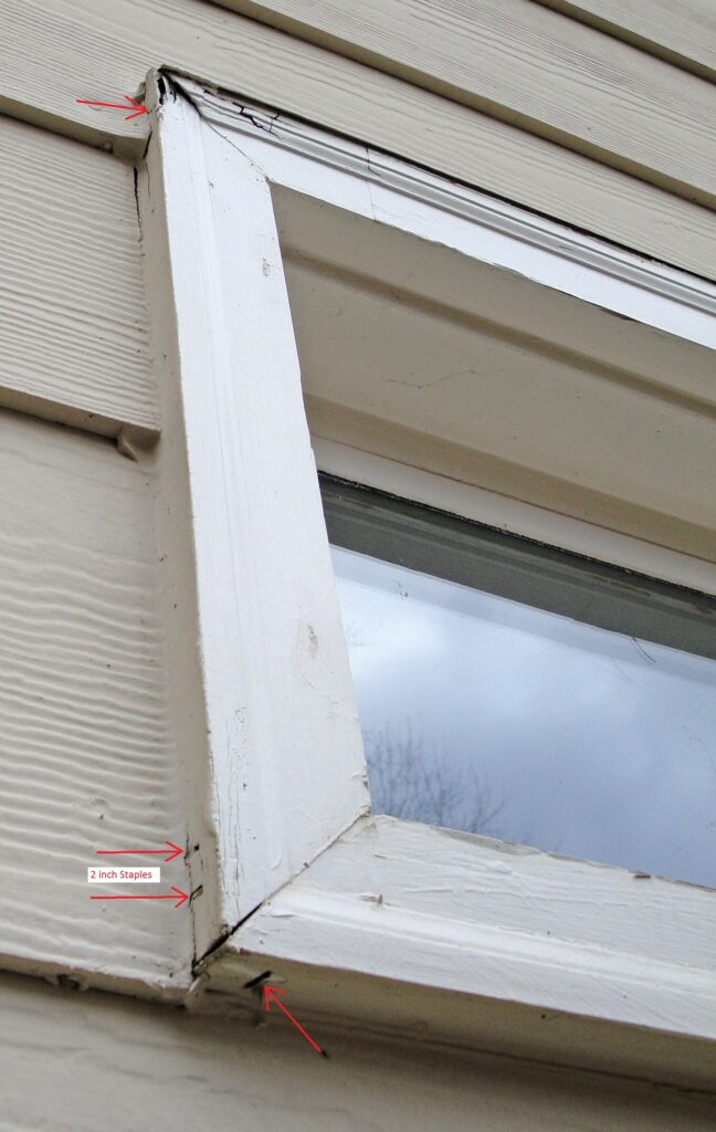 Staples Fasten the Corners of the Window Casing