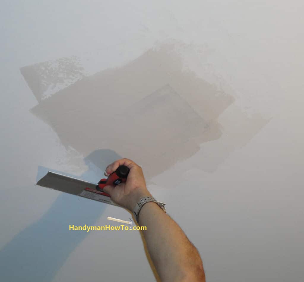 Water Damage Drywall Ceiling Repair: Finishing with a 12 inch Drywall Blade