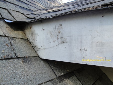 Rotted Fascia Board Resting on the Roof Shingles