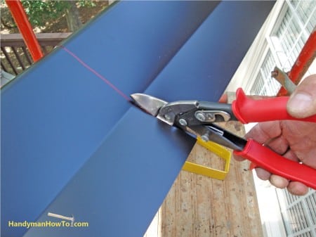 Cutting a Short Section of Gutter Cover with Tin Snips