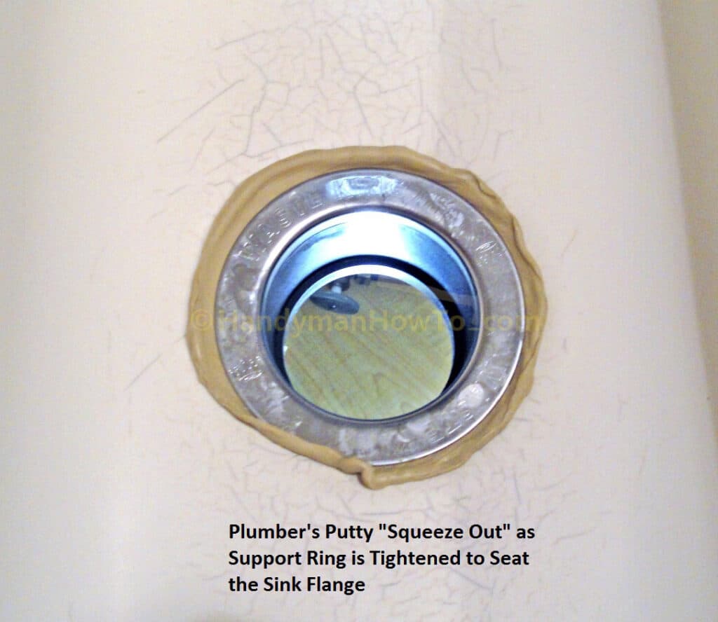 Plumber's Putty Squeeze Out around the Garbage Disposer Sink Flange