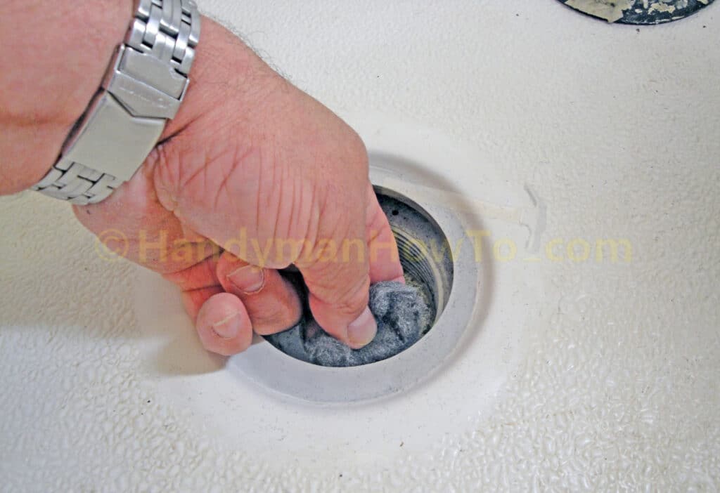 Shower Drain Leak Repair: Clean Bottom of the Shower Pan with Steel Wool