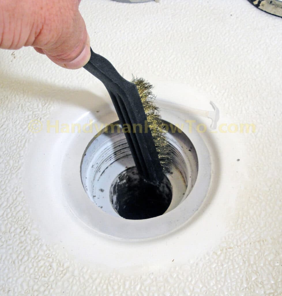 Clean the Shower Drain Body Threads with a Brass Wire Brush
