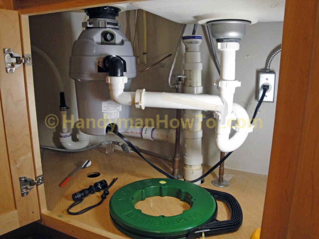 Fish Tape under the Kitchen Sink to Pull NM-B 12/2 Cable