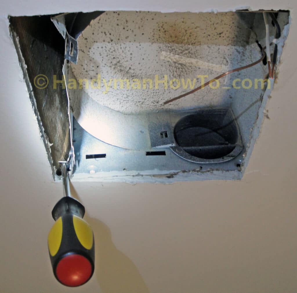 Bathroom Ceiling Fan Housing Removal: Pry Up the Mounting Staple