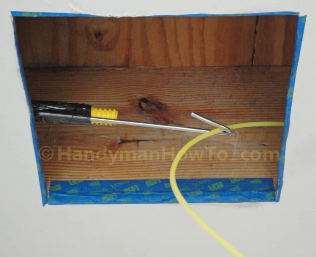Bathroom Vent Duct Installation: Nylon Fish Tape Pulled through Ceiling