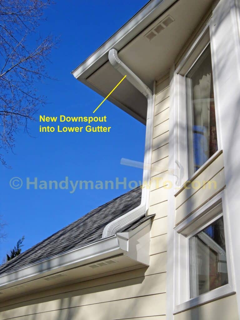 Gutter Downspout Piped to Lower Gutter