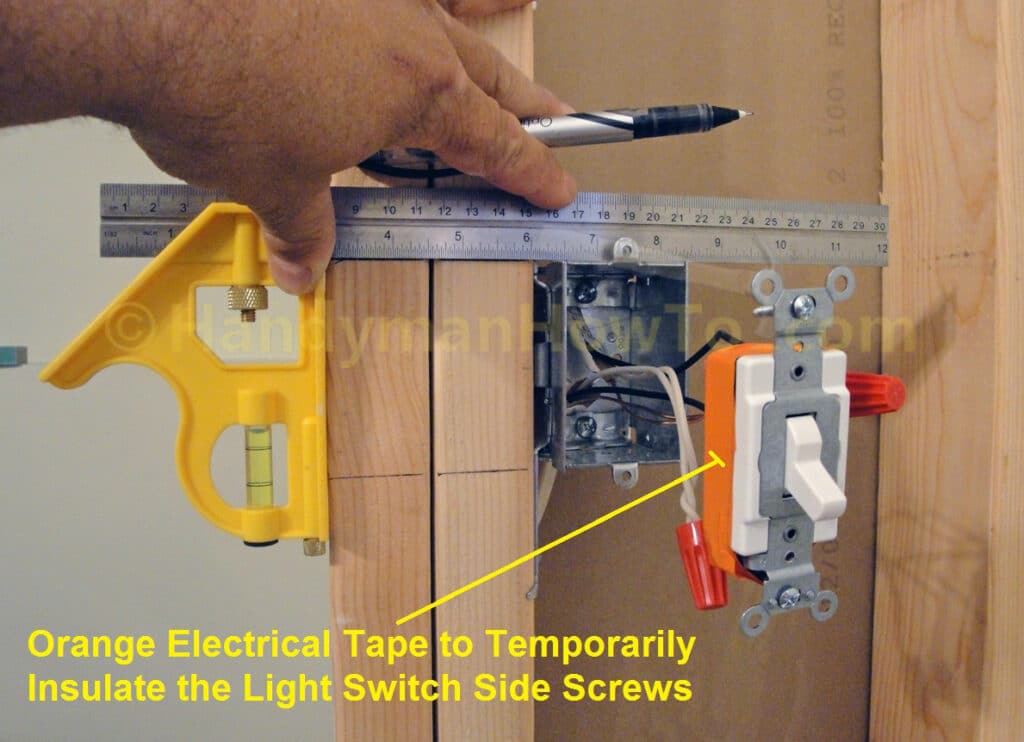 Light Switch Temporarily Insulated with Electrical Tape